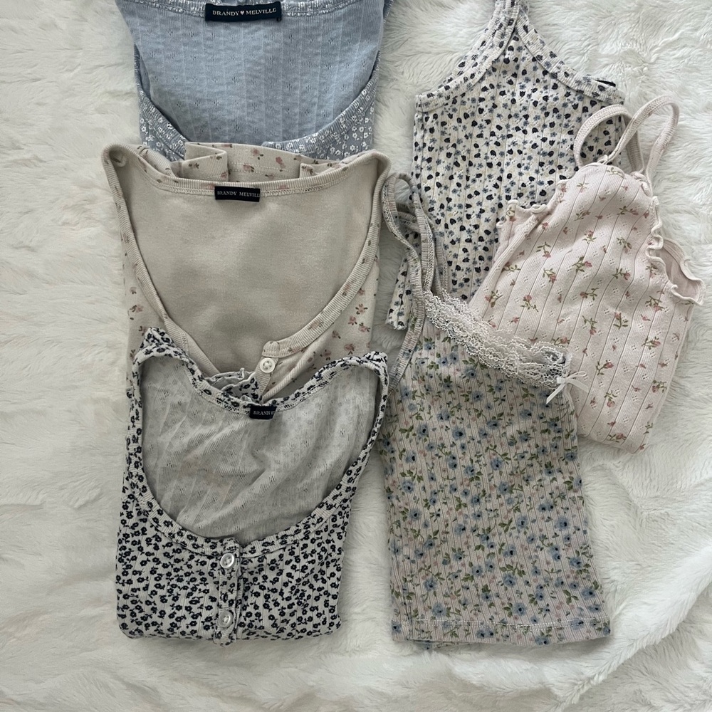 Brandy Melville bundle of pastel floral Zelly tops and assortment of tank tops.